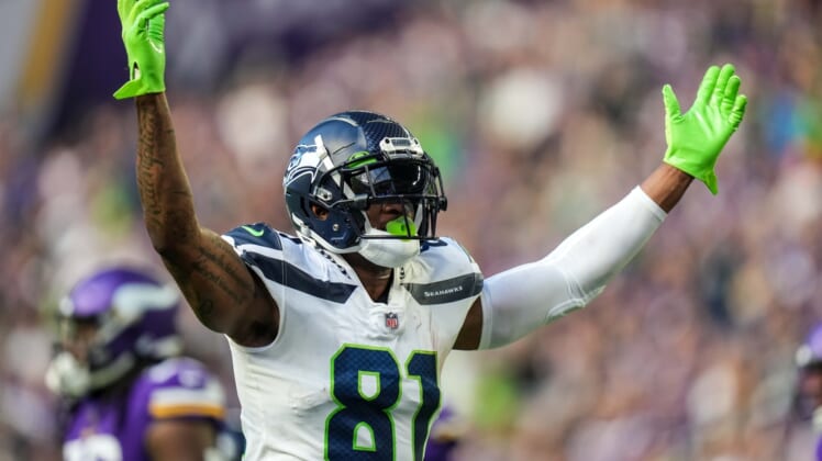 Sep 26, 2021; Minneapolis, Minnesota, USA; Seattle Seahawks tight end Gerald Everett (81) celebrates a touchdown scored by running back Chris Carson (not pictured) during the second quarter against Minnesota Vikings at U.S. Bank Stadium. Mandatory Credit: Brace Hemmelgarn-USA TODAY Sports