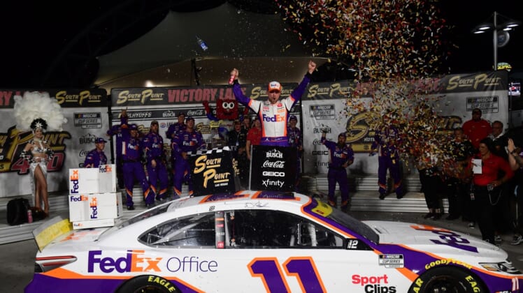 Sep 26, 2021; Las Vegas, Nevada, USA; NASCAR Cup Series driver Denny Hamlin (11) celebrates his victory of  the South Point 400 at Las Vegas Motor Speedway. Mandatory Credit: Gary A. Vasquez-USA TODAY Sports