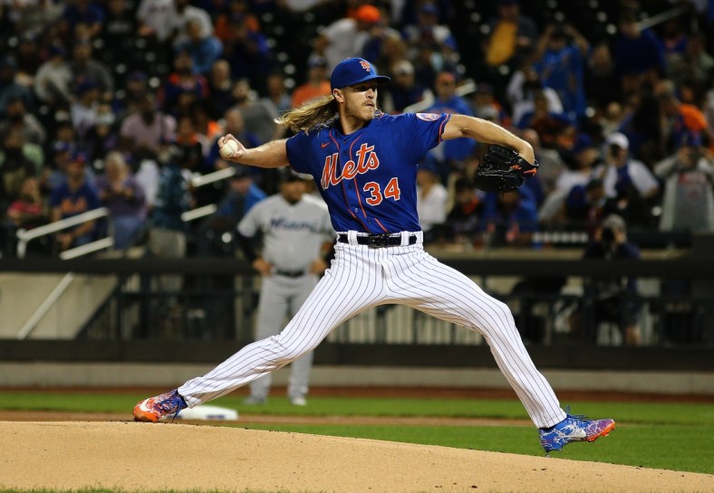 Sep 28, 2021; New York City, New York, USA; New York Mets starting pitcher Noah Syndergaard (34) delivers against the Miami Marlins during the first inning of game two of a doubleheader at Citi Field. Mandatory Credit: Andy Marlin-USA TODAY Sports