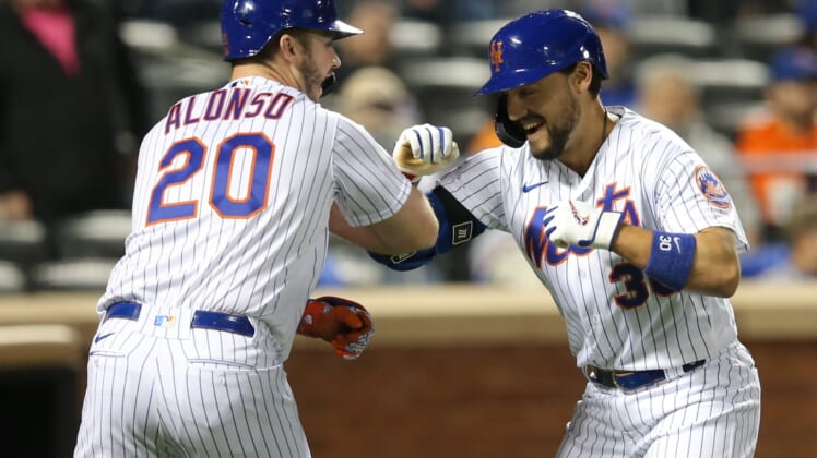 Sep 29, 2021; New York City, New York, USA; New York Mets right fielder Michael Conforto (30) celebrates with first baseman Pete Alonso (20) after hitting a solo home run against the Miami Marlins during the fourth inning at Citi Field. Mandatory Credit: Brad Penner-USA TODAY Sports
