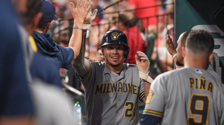 Sep 29, 2021; St. Louis, Missouri, USA; Milwaukee Brewers shortstop Willy Adames (27) celebrates after scoring a run against the St. Louis Cardinals during the first inning at Busch Stadium. Mandatory Credit: Joe Puetz-USA TODAY Sports