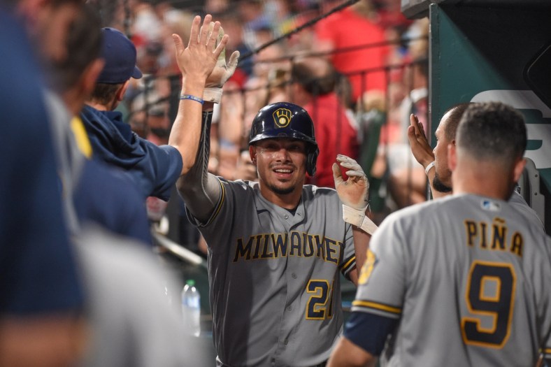 Sep 29, 2021; St. Louis, Missouri, USA; Milwaukee Brewers shortstop Willy Adames (27) celebrates after scoring a run against the St. Louis Cardinals during the first inning at Busch Stadium. Mandatory Credit: Joe Puetz-USA TODAY Sports