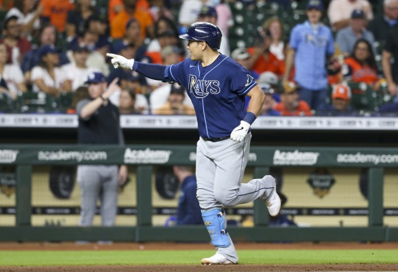 Sep 29, 2021; Houston, Texas, USA; Tampa Bay Rays first baseman Ji-Man Choi (26) reacts to his three run home run against the Houston Astros in the fifth inning at Minute Maid Park. Mandatory Credit: Thomas Shea-USA TODAY Sports