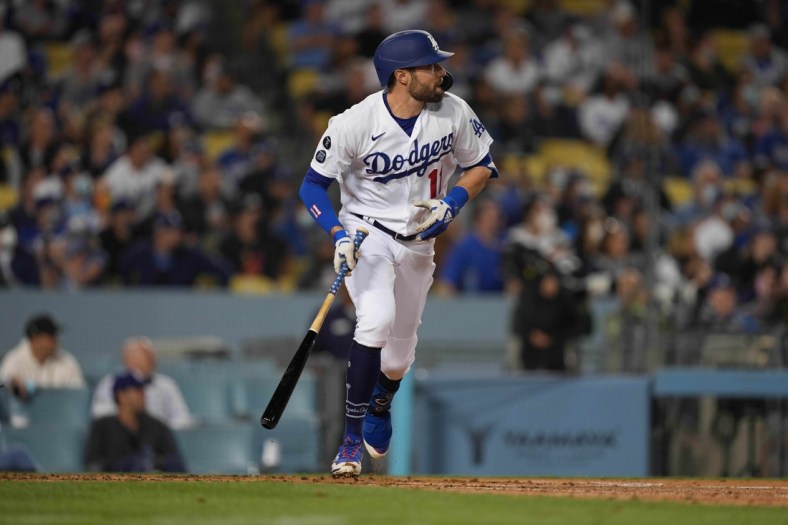 Sep 29, 2021; Los Angeles, California, USA; Los Angeles Dodgers left fielder AJ Pollock (11) watches his two-run home run in the first inning against the San Diego Padres at Dodger Stadium. Mandatory Credit: Kirby Lee-USA TODAY Sports