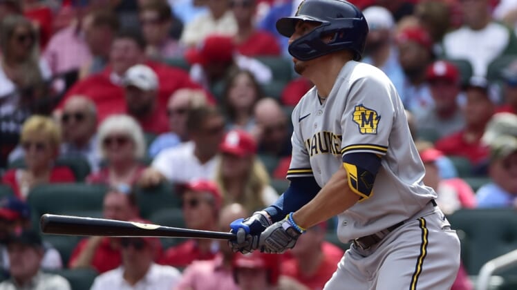 Sep 30, 2021; St. Louis, Missouri, USA;  Milwaukee Brewers right fielder Tyrone Taylor (15) hits a single during the fourth inning against the St. Louis Cardinals at Busch Stadium. Mandatory Credit: Jeff Curry-USA TODAY Sports