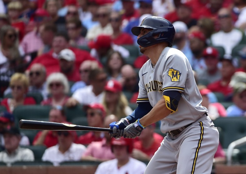 Sep 30, 2021; St. Louis, Missouri, USA;  Milwaukee Brewers right fielder Tyrone Taylor (15) hits a single during the fourth inning against the St. Louis Cardinals at Busch Stadium. Mandatory Credit: Jeff Curry-USA TODAY Sports