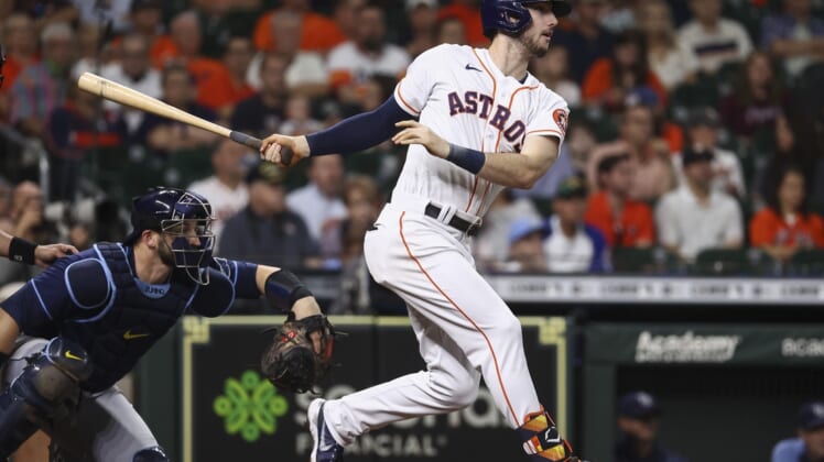 Sep 30, 2021; Houston, Texas, USA; Houston Astros right fielder Kyle Tucker (30) hits a double during the second inning against the Tampa Bay Rays at Minute Maid Park. Mandatory Credit: Troy Taormina-USA TODAY Sports