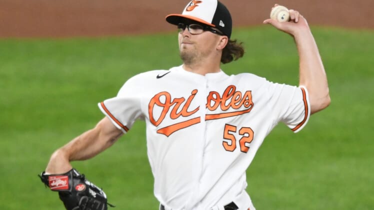 Sep 30, 2021; Baltimore, Maryland, USA; Baltimore Orioles relief pitcher Alexander Wells (52) pitches in the first inning during baseball game against the Boston Red Sox at Oriole Park at Camden Yards. Mandatory Credit: Mitchell Layton-USA TODAY Sports