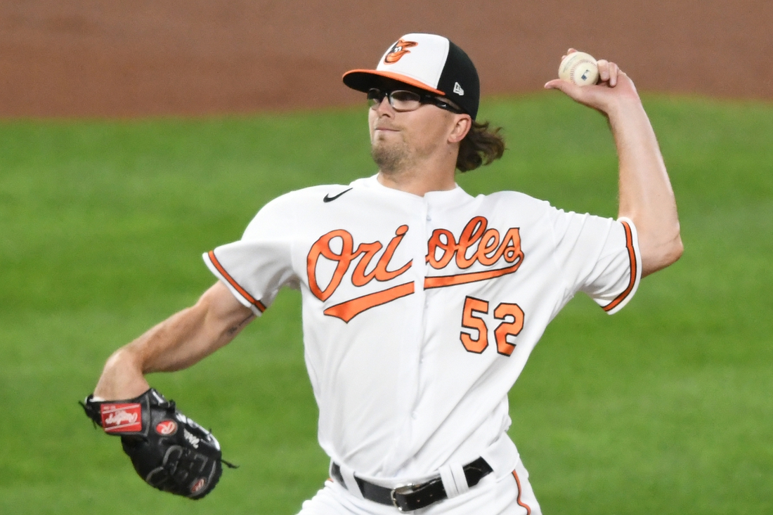 Sep 30, 2021; Baltimore, Maryland, USA; Baltimore Orioles relief pitcher Alexander Wells (52) pitches in the first inning during baseball game against the Boston Red Sox at Oriole Park at Camden Yards. Mandatory Credit: Mitchell Layton-USA TODAY Sports