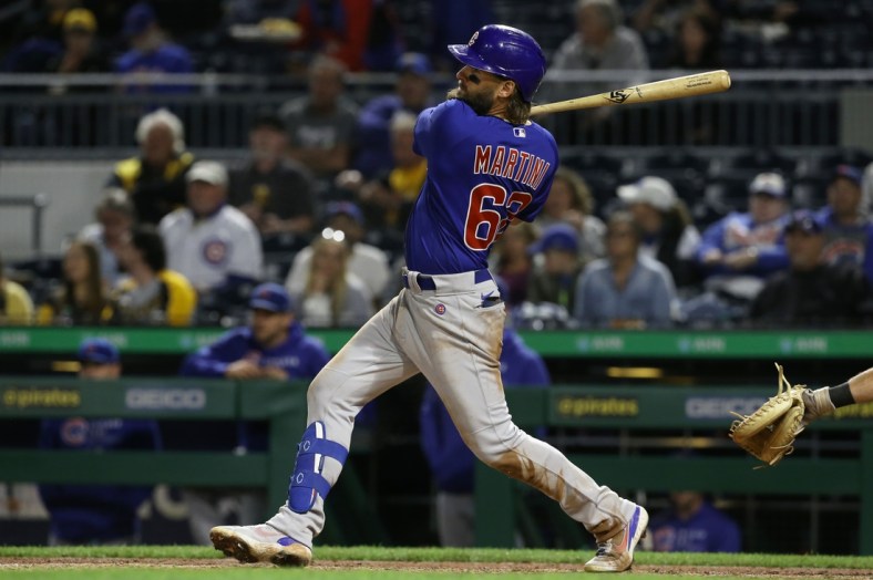 Sep 30, 2021; Pittsburgh, Pennsylvania, USA; Chicago Cubs right fielder Nick Martini (62) singles against the Pittsburgh Pirates during the fifth inning at PNC Park. Mandatory Credit: Charles LeClaire-USA TODAY Sports