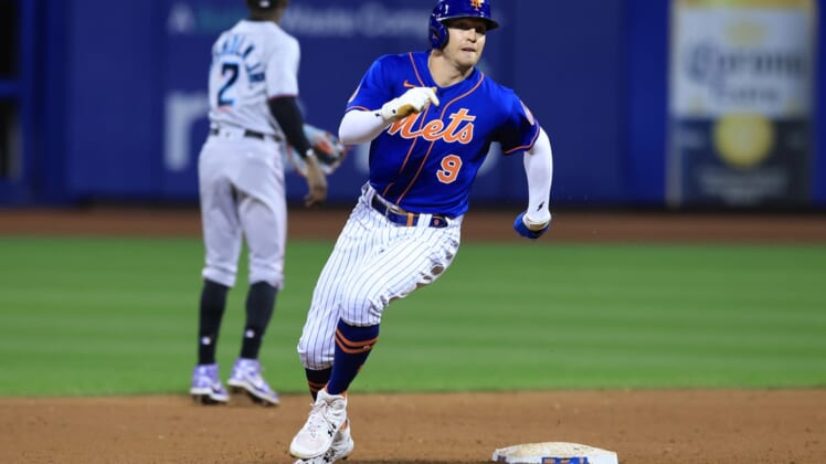 Sep 30, 2021; New York City, New York, USA; New York Mets center fielder Brandon Nimmo (9) rounds second base during an RBI single by right fielder Michael Conforto (not pictured) during the third inning against the Miami Marlins at Citi Field. Mandatory Credit: Vincent Carchietta-USA TODAY Sports