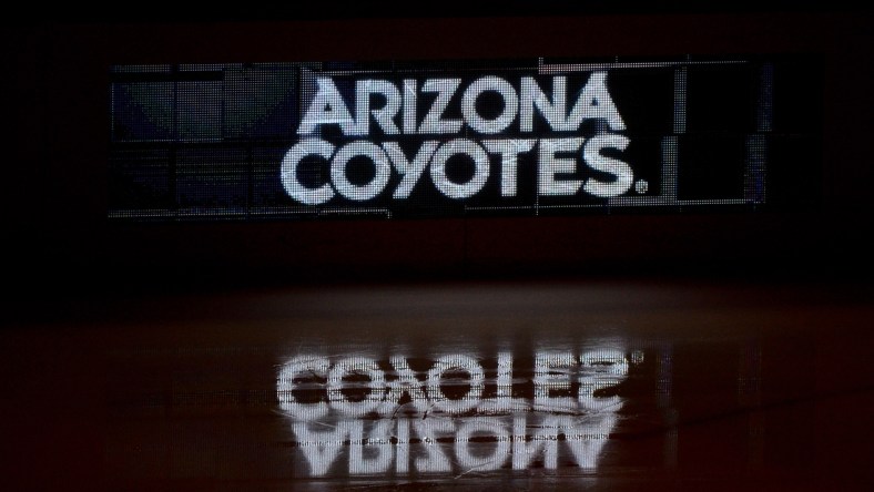 Oct 14, 2017; Glendale, AZ, USA; The Arizona Coyotes logo is reflected on the ice prior to the game against the Boston Bruins at Gila River Arena. Mandatory Credit: Matt Kartozian-USA TODAY Sports