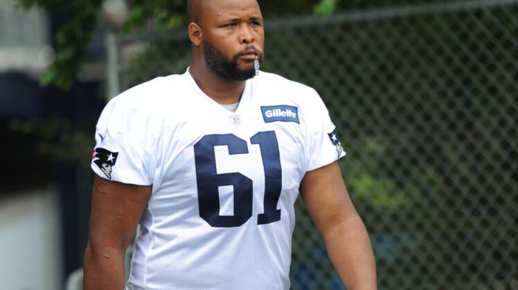 Jul 26, 2018; Foxborough, MA, USA; New England Patriots offensive lineman Marcus Cannon (61) walks to the practice field during training camp at Gillette Stadium. Mandatory Credit: Bob DeChiara-USA TODAY Sports