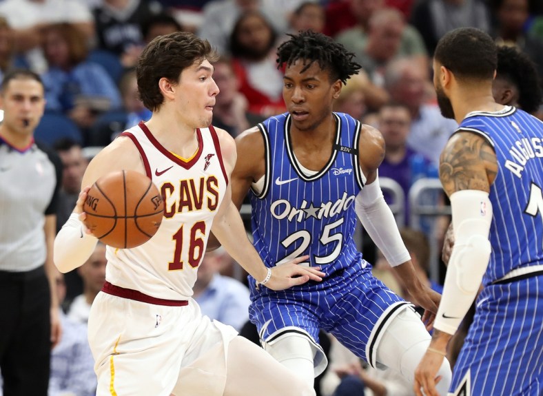 Mar 14, 2019; Orlando, FL, USA; Cleveland Cavaliers forward Cedi Osman (16) drives to the basket as Orlando Magic forward Wesley Iwundu (25) defends during the first quarter at Amway Center. Mandatory Credit: Kim Klement-USA TODAY Sports