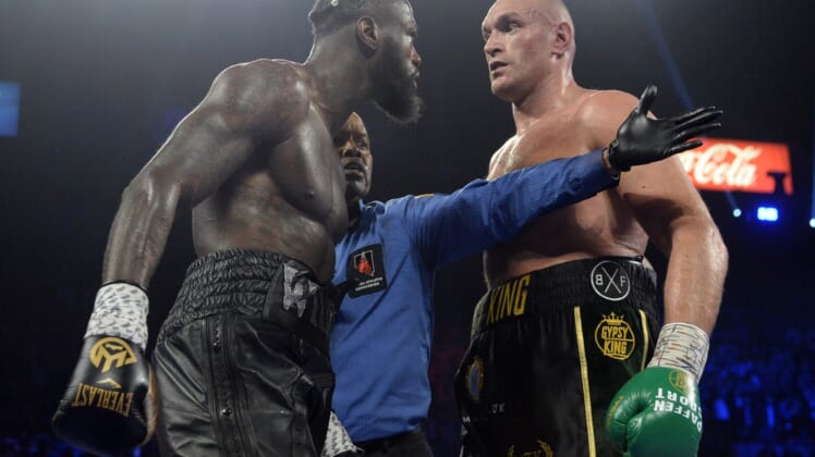 Feb 22, 2020; Las Vegas, Nevada, USA; Deontay Wilder and Tyson Fury stare at one another during their WBC heavyweight title bout at MGM Grand Garden Arena. Fury won via seventh round TKO. Mandatory Credit: Joe Camporeale-USA TODAY Sports