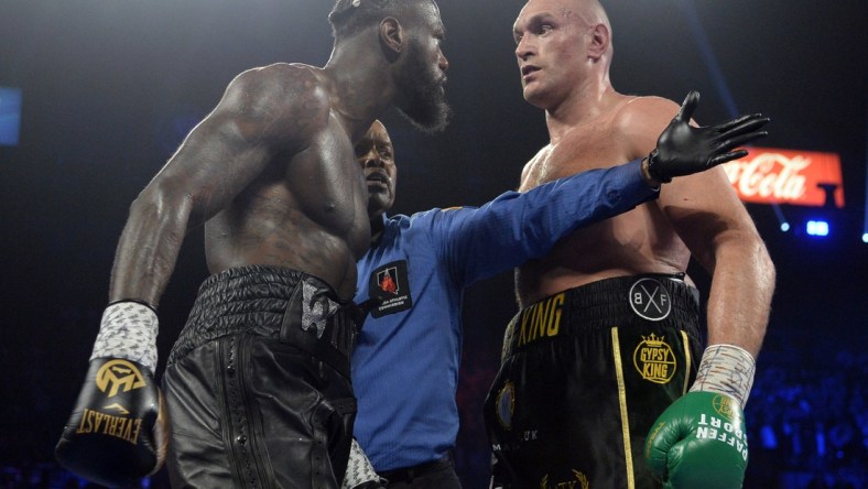 Feb 22, 2020; Las Vegas, Nevada, USA; Deontay Wilder and Tyson Fury stare at one another during their WBC heavyweight title bout at MGM Grand Garden Arena. Fury won via seventh round TKO. Mandatory Credit: Joe Camporeale-USA TODAY Sports