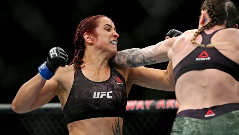 Feb 29, 2020; Norfolk, Virginia, USA; Megan Anderson (red gloves) fights Norma Dumont (blue gloves) during UFC Fight Night at Chartway Arena. Mandatory Credit: Peter Casey-USA TODAY Sports