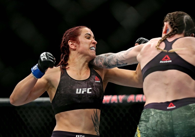 Feb 29, 2020; Norfolk, Virginia, USA; Megan Anderson (red gloves) fights Norma Dumont (blue gloves) during UFC Fight Night at Chartway Arena. Mandatory Credit: Peter Casey-USA TODAY Sports