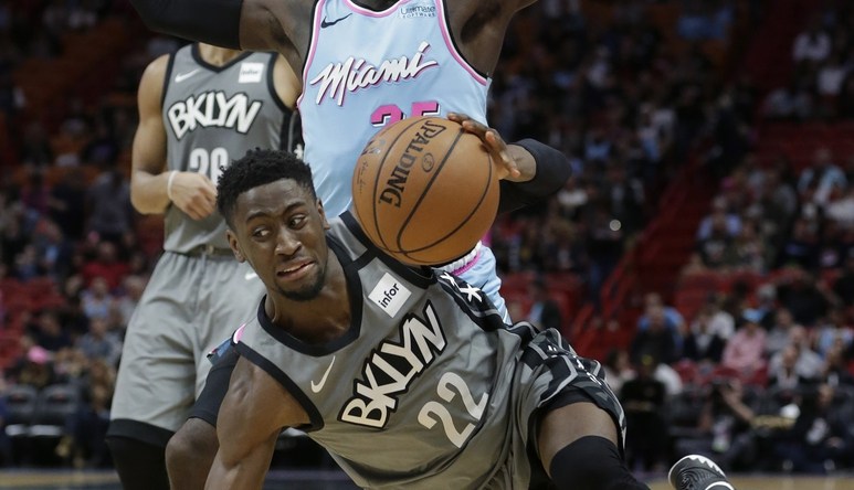 Feb 29, 2020; Miami, Florida, USA; Brooklyn Nets guard Caris LeVert (22) is defended by Miami Heat guard Kendrick Dunn (25) during the second half of their game at American Airlines Arena. Mandatory Credit: Rhona Wise-USA TODAY Sports