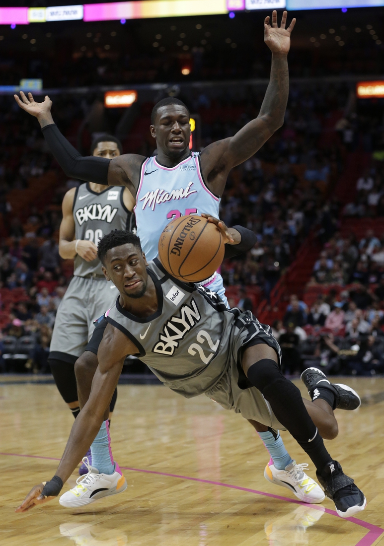 Feb 29, 2020; Miami, Florida, USA; Brooklyn Nets guard Caris LeVert (22) is defended by Miami Heat guard Kendrick Dunn (25) during the second half of their game at American Airlines Arena. Mandatory Credit: Rhona Wise-USA TODAY Sports