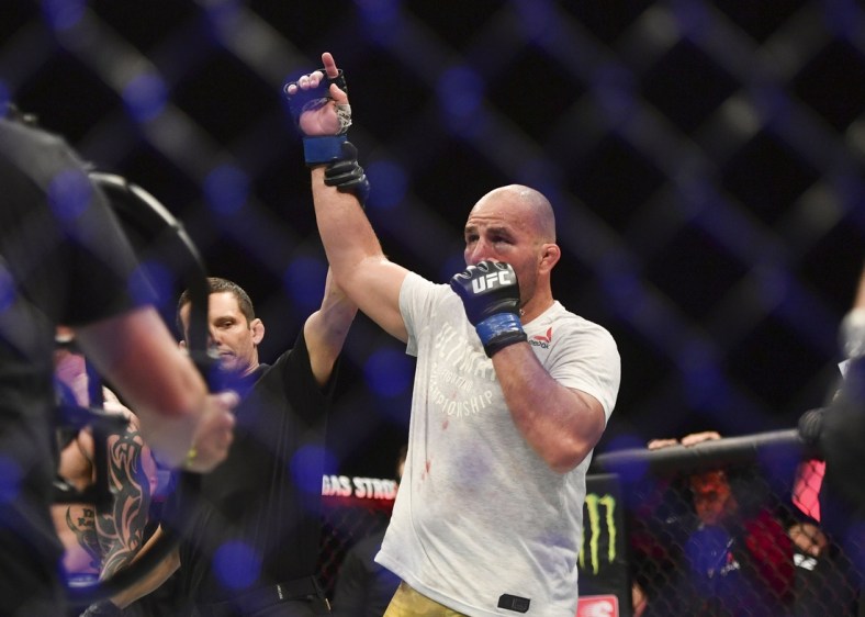 May 13, 2020; Jacksonville, Florida, USA; Glover Teixeira (blue gloves) celebrates after defeating Anthony Smith (red gloves) during UFC Fight Night at VyStar Veterans Memorial Arena. Mandatory Credit: Jasen Vinlove-USA TODAY Sports