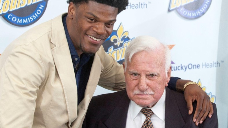 Baltimore Ravens quarterback Lamar Jackson, a former University of Louisville quarterback, puts his arm around former Cardinals head football coach Howard Schnellenberger in the VIP room of the Louisville Sports Commission's 2019 Paul Hornung Award Banquet.

ghows-LK-200608298-f26786f2.jpg