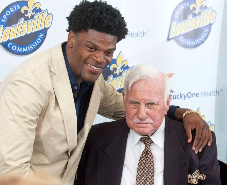 Baltimore Ravens quarterback Lamar Jackson, a former University of Louisville quarterback, puts his arm around former Cardinals head football coach Howard Schnellenberger in the VIP room of the Louisville Sports Commission's 2019 Paul Hornung Award Banquet.

ghows-LK-200608298-f26786f2.jpg