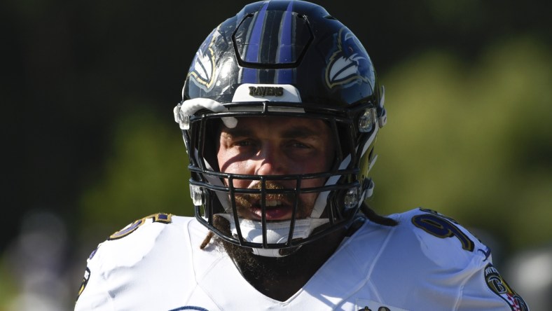 Aug 18, 2020; Owings Mills, Maryland, USA; Baltimore Ravens defensive end Derek Wolfe (95) stands on the field during the morning session of training camp at Under Armour Performance Center. Mandatory Credit: Tommy Gilligan-USA TODAY Sports