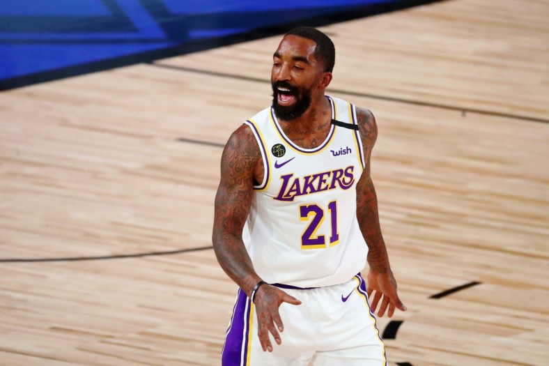 Oct 4, 2020; Orlando, Florida, USA; Los Angeles Lakers guard JR Smith (21) celebrates after making a three point basket against the Miami Heat during the second quarter of game three of the 2020 NBA Finals at AdventHealth Arena. Mandatory Credit: Kim Klement-USA TODAY Sports