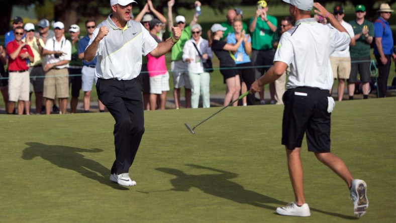 Oregon head coach Casey Martin celebrates with golfer  Sulman Raza after Raza made the match winning putt in his semifinal match against Illinois' Charlie Danielson to send the Ducks into the finals of the NCAA men's golf championship at Eugene Country Club in Eugene in 2016. [Andy Nelson/The Register-Guard] - registerguard.com

4he6klekv3h0a5c7xhglzbhb7vy