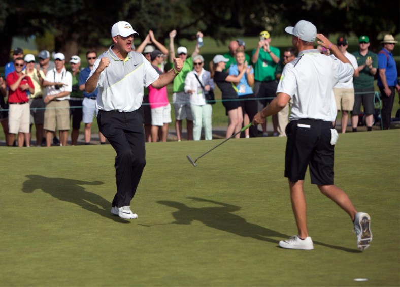 Oregon head coach Casey Martin celebrates with golfer  Sulman Raza after Raza made the match winning putt in his semifinal match against Illinois' Charlie Danielson to send the Ducks into the finals of the NCAA men's golf championship at Eugene Country Club in Eugene in 2016. [Andy Nelson/The Register-Guard] - registerguard.com

4he6klekv3h0a5c7xhglzbhb7vy