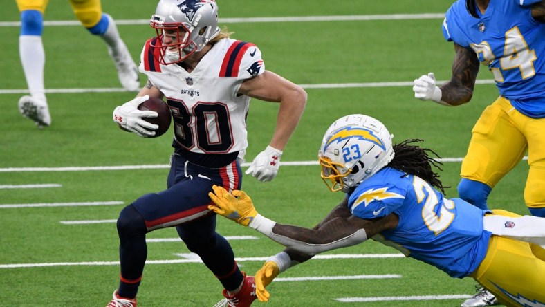 Dec 6, 2020; Inglewood, California, USA; New England Patriots wide receiver Gunner Olszewski (80) runs past Los Angeles Chargers strong safety Rayshawn Jenkins (23) in the fourth quarter at SoFi Stadium. Mandatory Credit: Robert Hanashiro-USA TODAY Sports