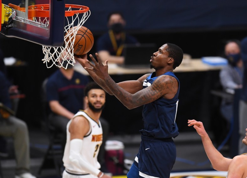 Jan 5, 2021; Denver, Colorado, USA; Minnesota Timberwolves forward Ed Davis (17) shoots the ball against the Denver Nuggets in the third quarter at Ball Arena. Mandatory Credit: Ron Chenoy-USA TODAY Sports