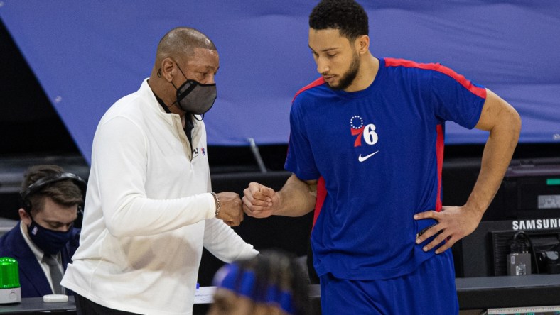 Jan 27, 2021; Philadelphia, Pennsylvania, USA; Philadelphia 76ers guard Ben Simmons (R) fist bumps head coach Doc Rivers (L) before a game against the Los Angeles Lakers at Wells Fargo Center. Mandatory Credit: Bill Streicher-USA TODAY Sports