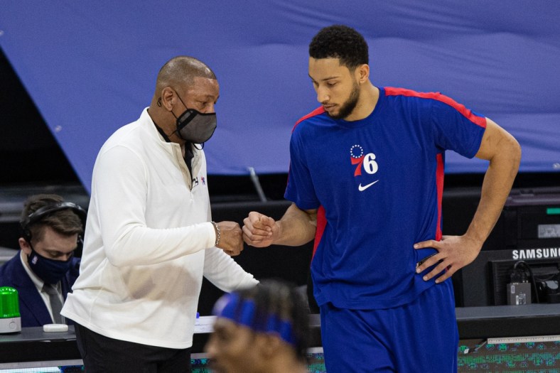 Jan 27, 2021; Philadelphia, Pennsylvania, USA; Philadelphia 76ers guard Ben Simmons (R) fist bumps head coach Doc Rivers (L) before a game against the Los Angeles Lakers at Wells Fargo Center. Mandatory Credit: Bill Streicher-USA TODAY Sports