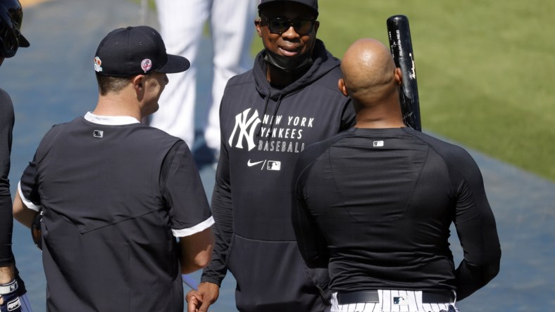 Feb 23, 2021; Tampa, Florida, USA; New York Yankees hitting coach Marcus Thames (72) talks with outfielder Jay Bruce (30) and center fielder Aaron Hicks (31)  at George M. Steinbrenner Field. Mandatory Credit: Kim Klement-USA TODAY Sports