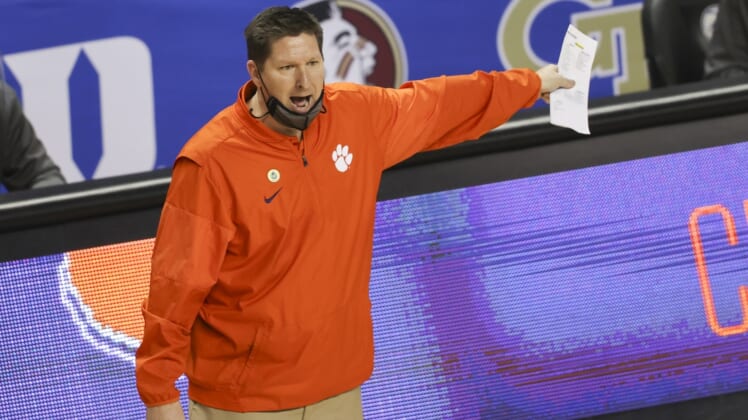 Mar 10, 2021; Greensboro, North Carolina, USA; Clemson Tigers head coach Brad Brownell yells at an official as his team plays the Miami Hurricanes during the second half in the second round of the 2021 ACC tournament at Greensboro Coliseum. The Miami Hurricanes won 67-64. Mandatory Credit: Nell Redmond-USA TODAY Sports