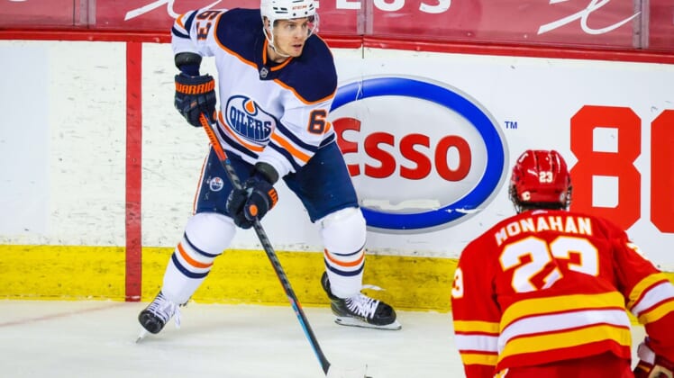 Mar 15, 2021; Calgary, Alberta, CAN; Edmonton Oilers left wing Tyler Ennis (63) controls the puck against the Calgary Flames during the second period at Scotiabank Saddledome. Mandatory Credit: Sergei Belski-USA TODAY Sports