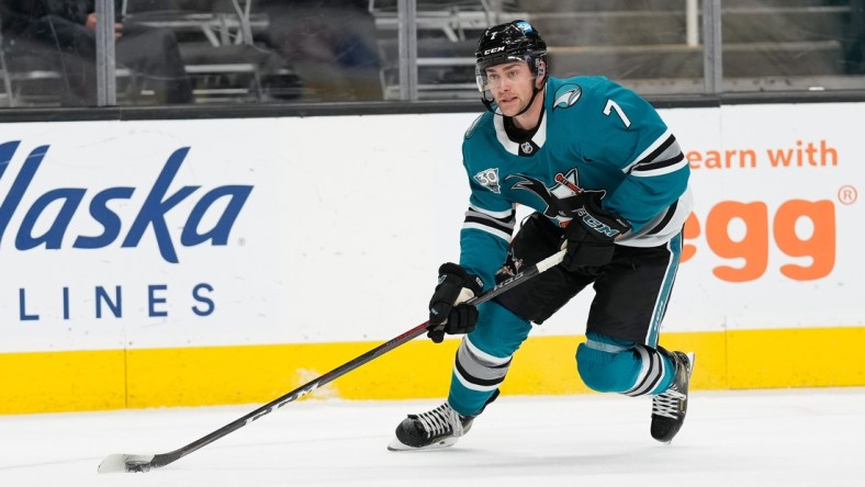 Apr 9, 2021; San Jose, California, USA;  San Jose Sharks center Dylan Gambrell (7) controls the puck during the third period against the Los Angeles Kings at SAP Center at San Jose. Mandatory Credit: Stan Szeto-USA TODAY Sports