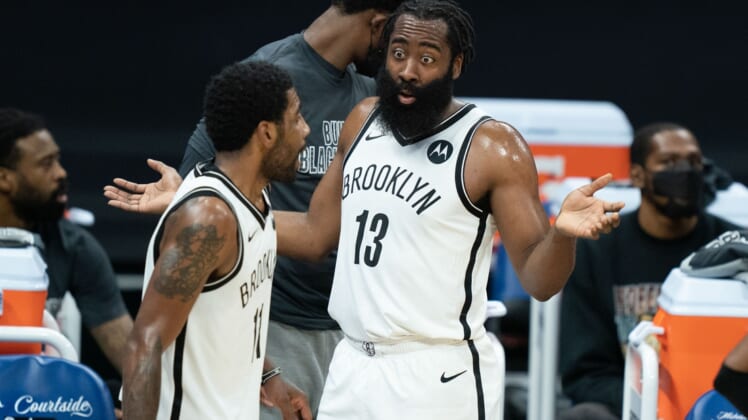 February 15, 2021; Sacramento, California, USA;  Brooklyn Nets guard James Harden (13, right) and guard Kyrie Irving (11, left) during the first quarter against the Sacramento Kings at Golden 1 Center. Mandatory Credit: Kyle Terada-USA TODAY Sports