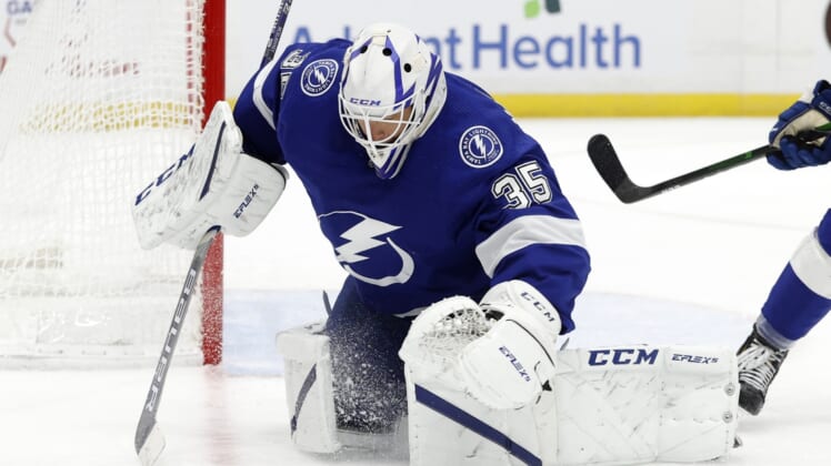 Apr 22, 2021; Tampa, Florida, USA; Tampa Bay Lightning goaltender Curtis McElhinney (35) makes a save against the Columbus Blue Jackets during the second period at Amalie Arena. Mandatory Credit: Kim Klement-USA TODAY Sports