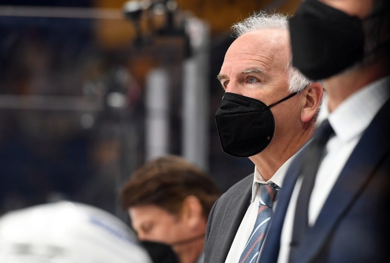 Apr 26, 2021; Nashville, Tennessee, USA; Florida Panthers head coach Joel Quenneville looks on from the bench during the second period against the Nashville Predators at Bridgestone Arena. Mandatory Credit: Christopher Hanewinckel-USA TODAY Sports