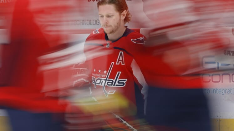 Apr 27, 2021; Washington, District of Columbia, USA; Washington Capitals center Nicklas Backstrom (19) kneels on the ice during warmups prior to the Capitals' game against the New York Islanders at Capital One Arena. Mandatory Credit: Geoff Burke-USA TODAY Sports
