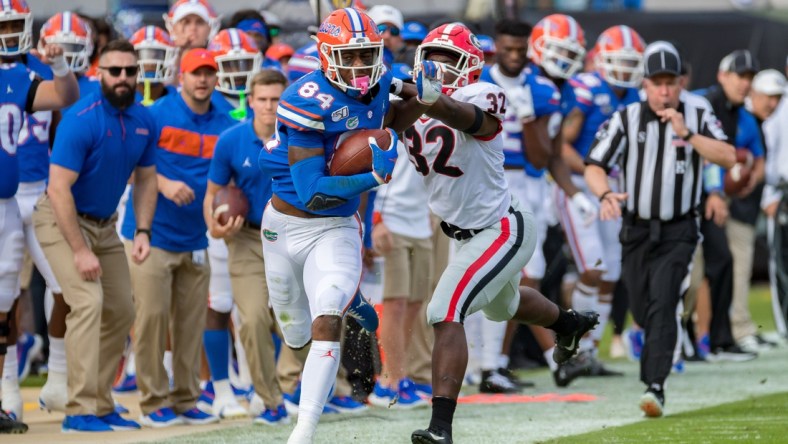 Florida Gators tight end Kyle Pitts (84) runs after a catch during the game featuring the #6 Florida Gators and the #8 Georgia Bulldogs at TIAA Bank Field in Jacksonville, FL on Saturday, November 2, 2019. [Matt Pendleton/Correspondent]

Fl Gai 1102 Flgagamer 4318