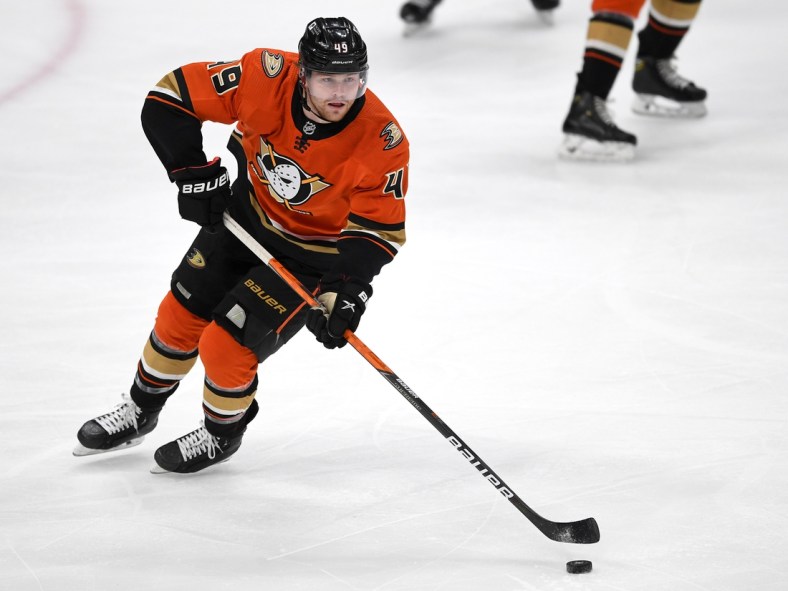 May 1, 2021; Anaheim, California, USA;  Anaheim Ducks left wing Max Jones (49) takes the puck down ice in the first period of the game against the Anaheim Ducks at Honda Center. Mandatory Credit: Jayne Kamin-Oncea-USA TODAY Sports