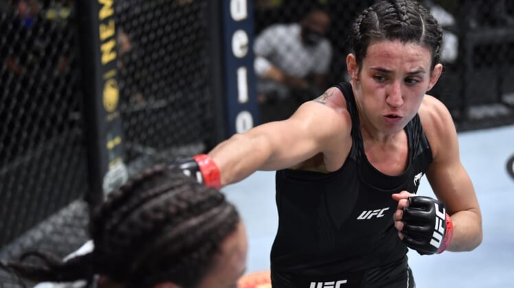 May 8, 2021; Las Vegas, NV, USA; Marina Rodriguez of Brazil punches Michelle Waterson in a flyweight fight during the UFC Fight Night event at UFC APEX on May 08, 2021 in Las Vegas, Nevada.    Mandatory Credit: Chris Unger/Handout Photo via USA TODAY Sports