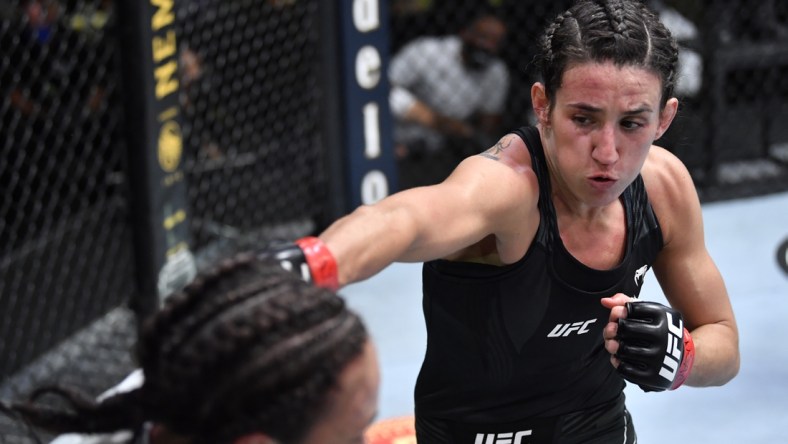 May 8, 2021; Las Vegas, NV, USA; Marina Rodriguez of Brazil punches Michelle Waterson in a flyweight fight during the UFC Fight Night event at UFC APEX on May 08, 2021 in Las Vegas, Nevada.    Mandatory Credit: Chris Unger/Handout Photo via USA TODAY Sports