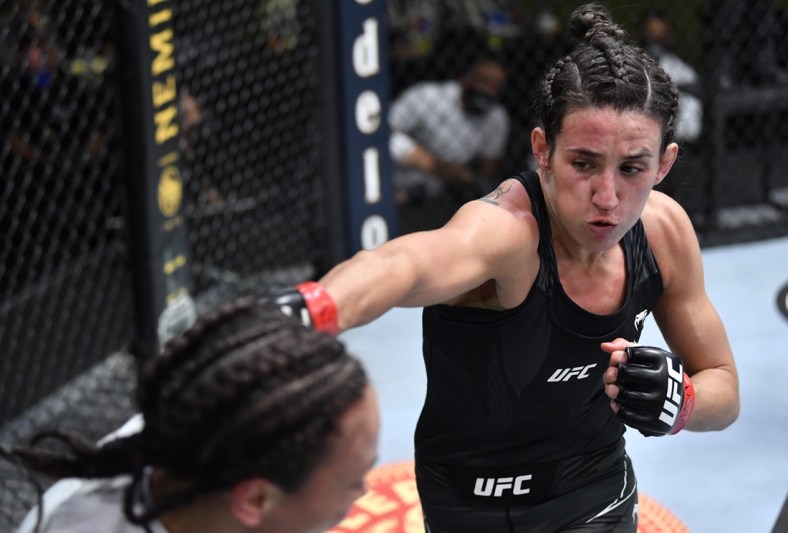 May 8, 2021; Las Vegas, NV, USA; Marina Rodriguez of Brazil punches Michelle Waterson in a flyweight fight during the UFC Fight Night event at UFC APEX on May 08, 2021 in Las Vegas, Nevada.    Mandatory Credit: Chris Unger/Handout Photo via USA TODAY Sports