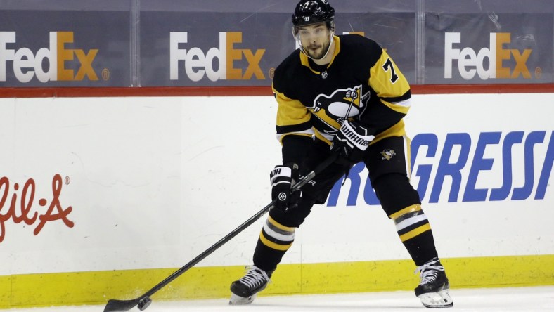 May 8, 2021; Pittsburgh, Pennsylvania, USA;  Pittsburgh Penguins center Colton Sceviour (7) skates with the puck against the Buffalo Sabres during the first period at PPG Paints Arena. Mandatory Credit: Charles LeClaire-USA TODAY Sports