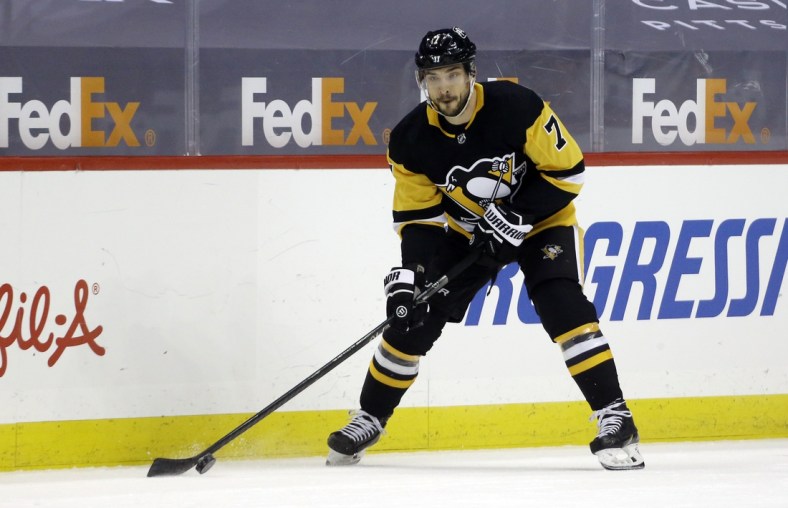 May 8, 2021; Pittsburgh, Pennsylvania, USA;  Pittsburgh Penguins center Colton Sceviour (7) skates with the puck against the Buffalo Sabres during the first period at PPG Paints Arena. Mandatory Credit: Charles LeClaire-USA TODAY Sports